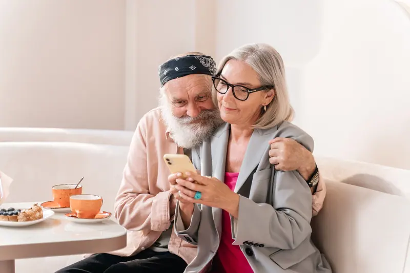 A couple looking at photos on a phone