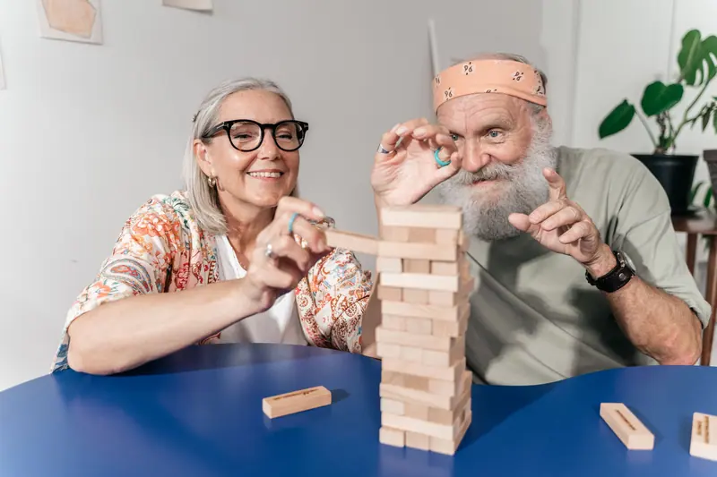 Two residents in the middle of a tense game of stacking blocks