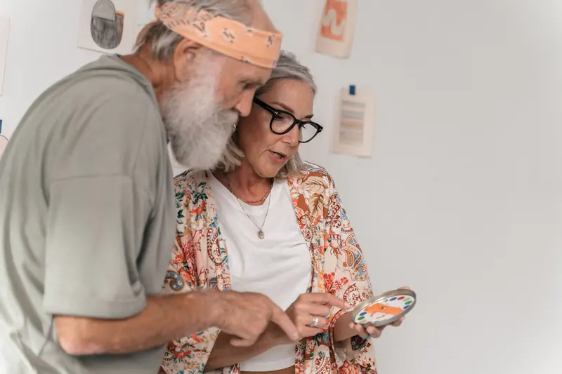 A couple looking at photos from the grandkids