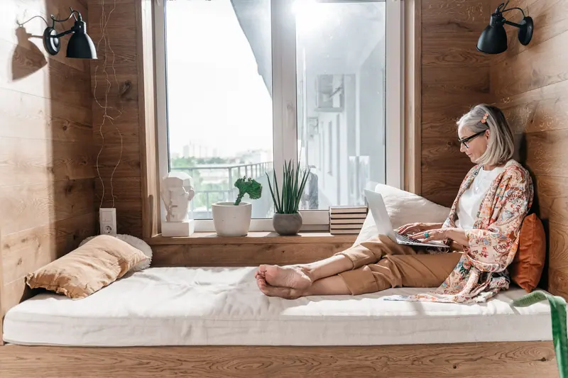 A resident reading in her window seat