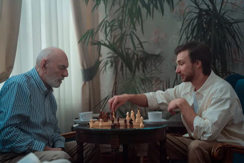 A tense chess match in the card room