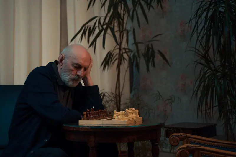 A resident studying the chess board