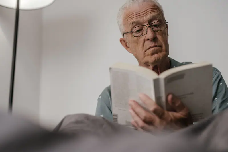 A resident reading in the library