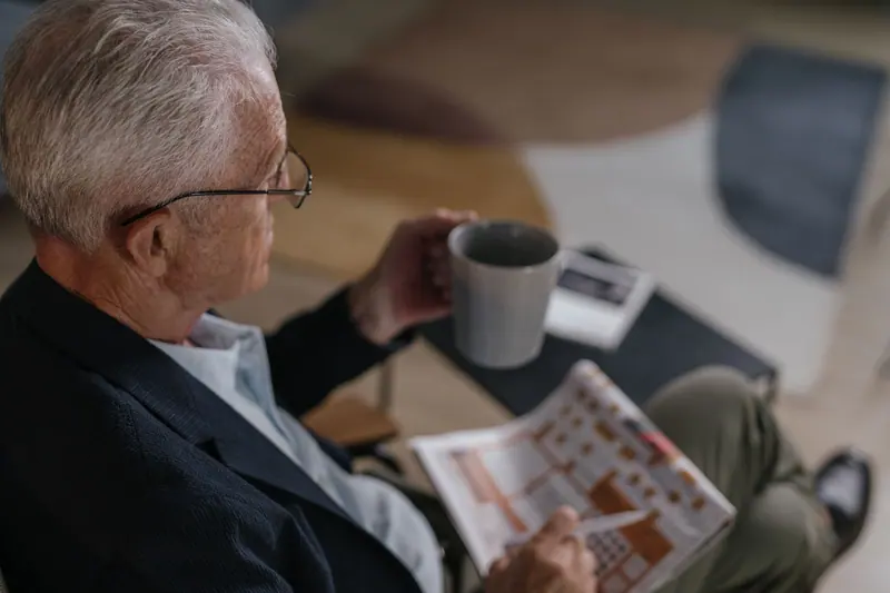 A resident with coffee and the newspaper