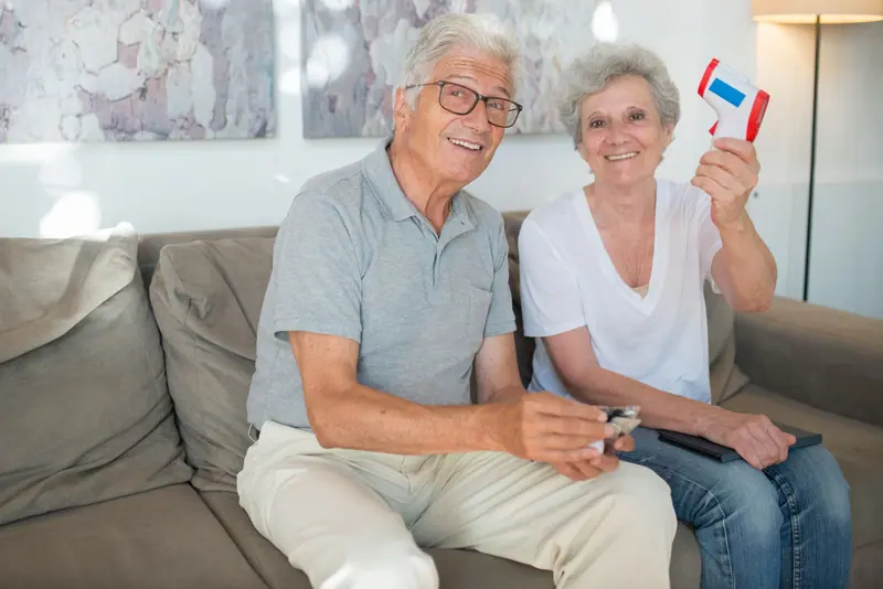 A couple showing off a souvenir