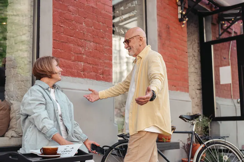Neighbors greeting each other at the café