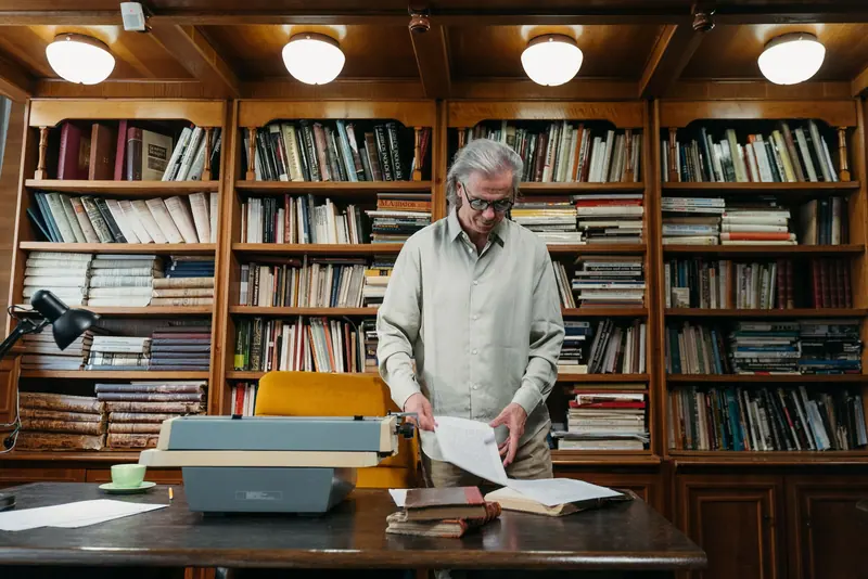 A resident browsing the shelves of the library
