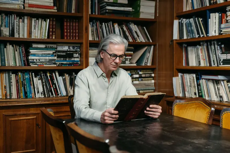 A resident reading in the library