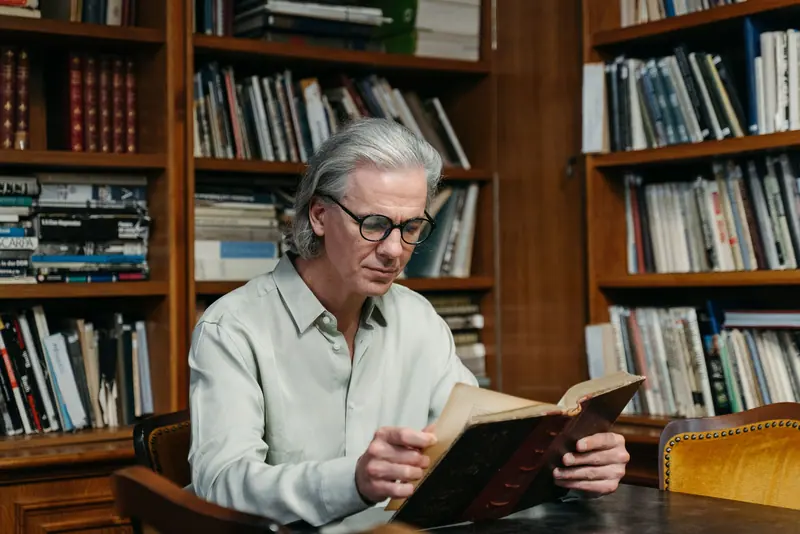 A resident reading in the library