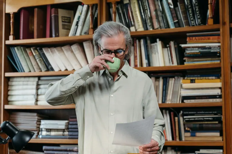 A resident with coffee and a letter