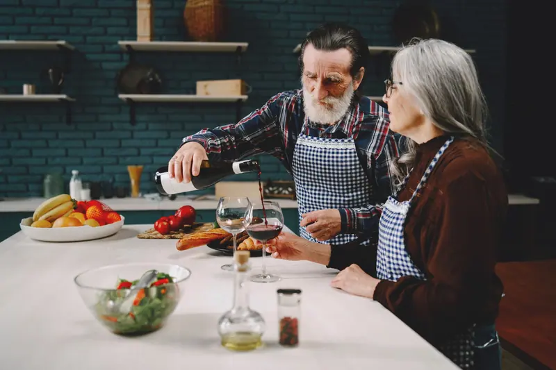 A couple cooking supper together