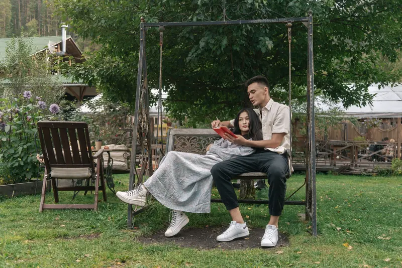A couple on the garden swing