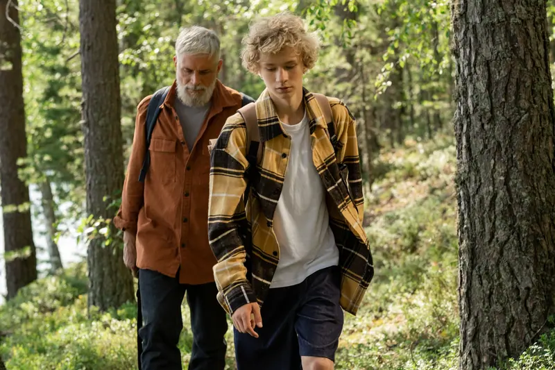 A couple walking the wooded path