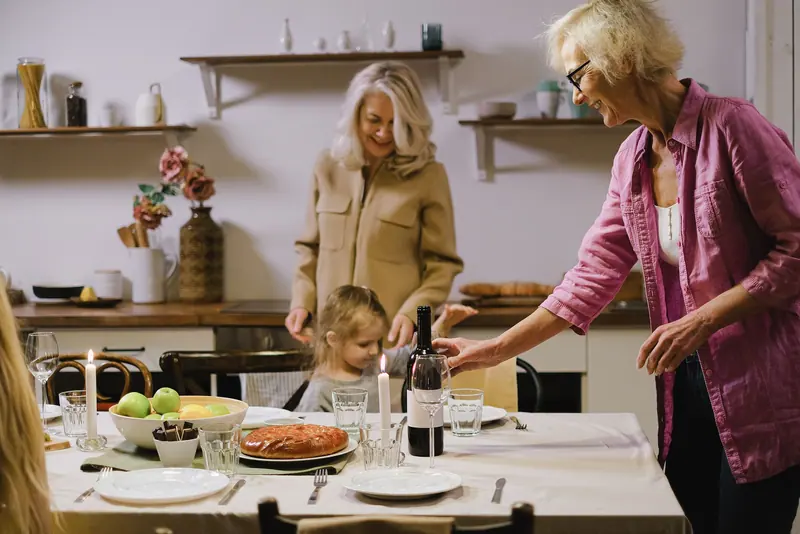 Three generations sharing a big family dinner