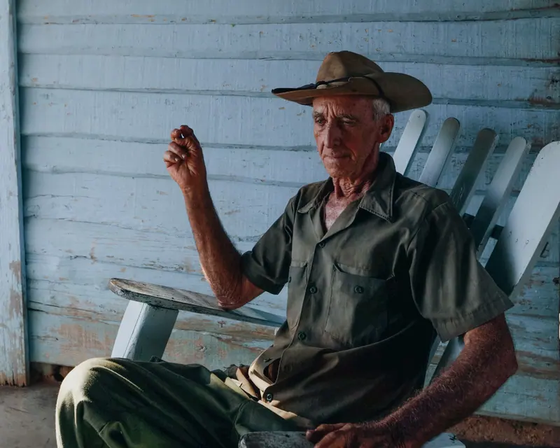 A rancher telling a story from his porch chair
