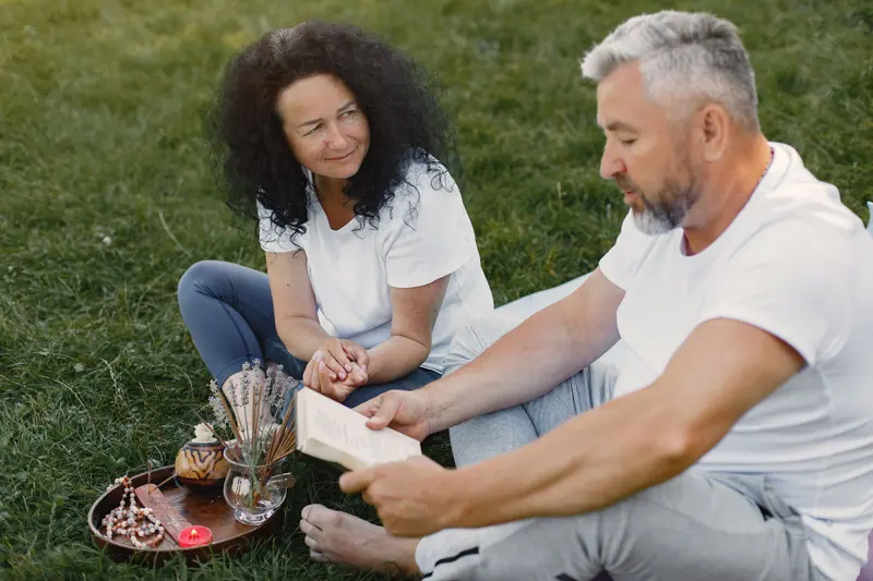 A couple reading together in the park