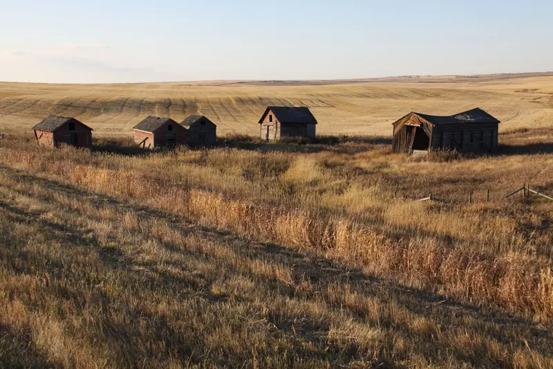 Old barns across open fields
