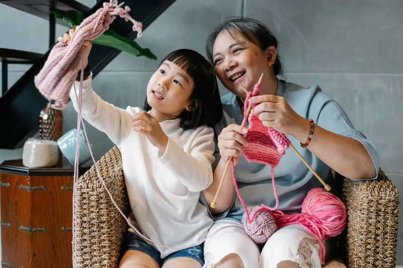 Three generations knitting together