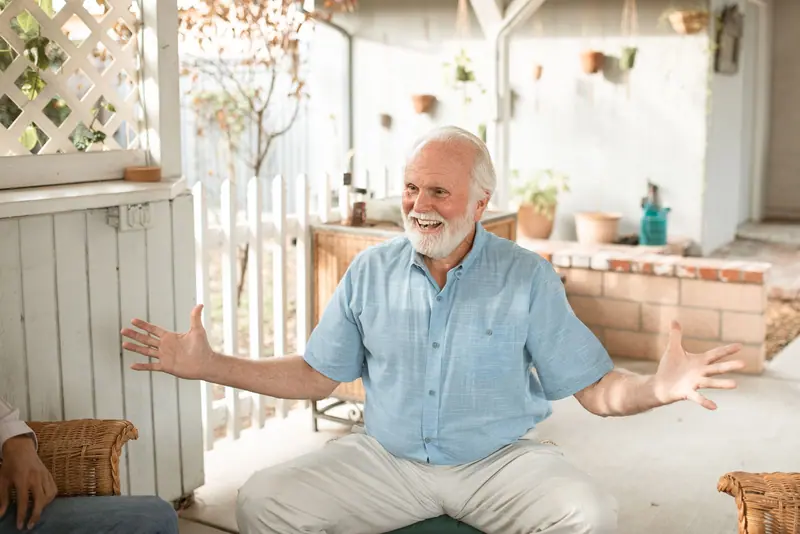 A grandfather telling a story on the back porch