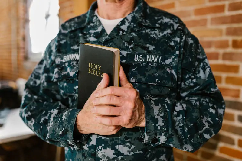 A Navy veteran holding his Bible