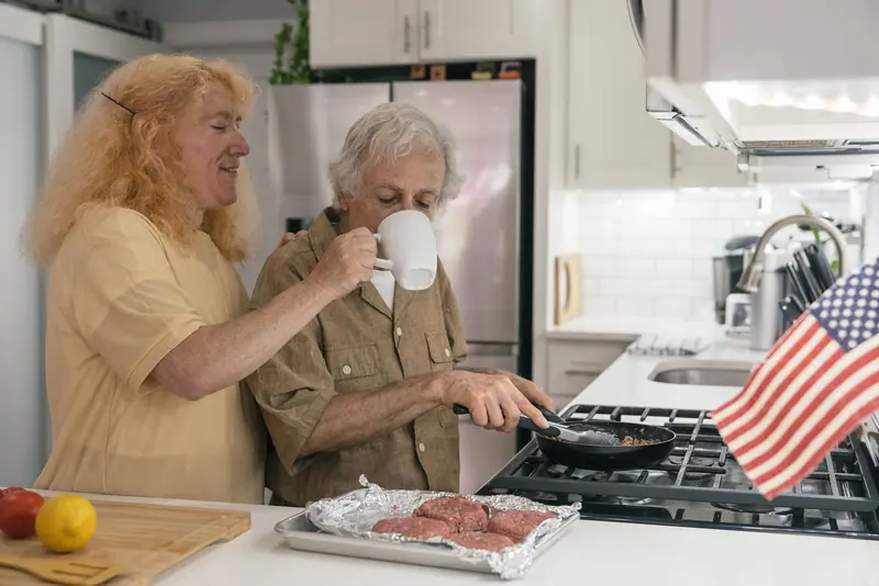 A mother and daughter cooking together
