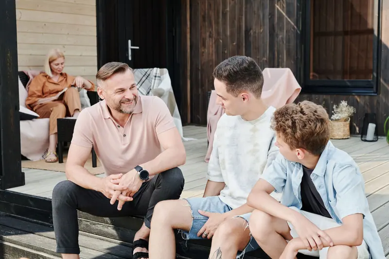 A family sharing time on the deck
