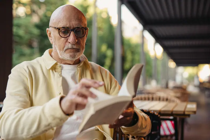 A patient reading on the porch on a breezy afternoon