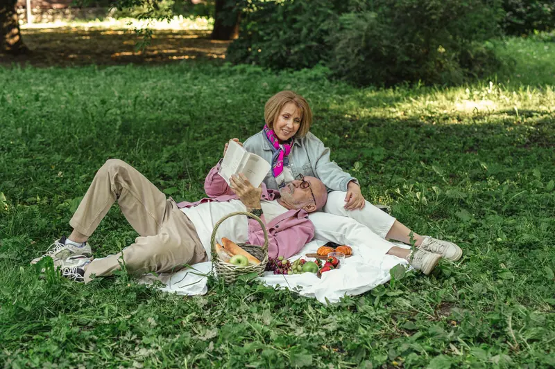 A couple on a picnic blanket