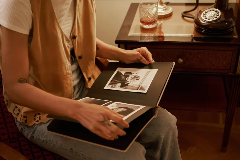 A daughter showing her mother an old photo album