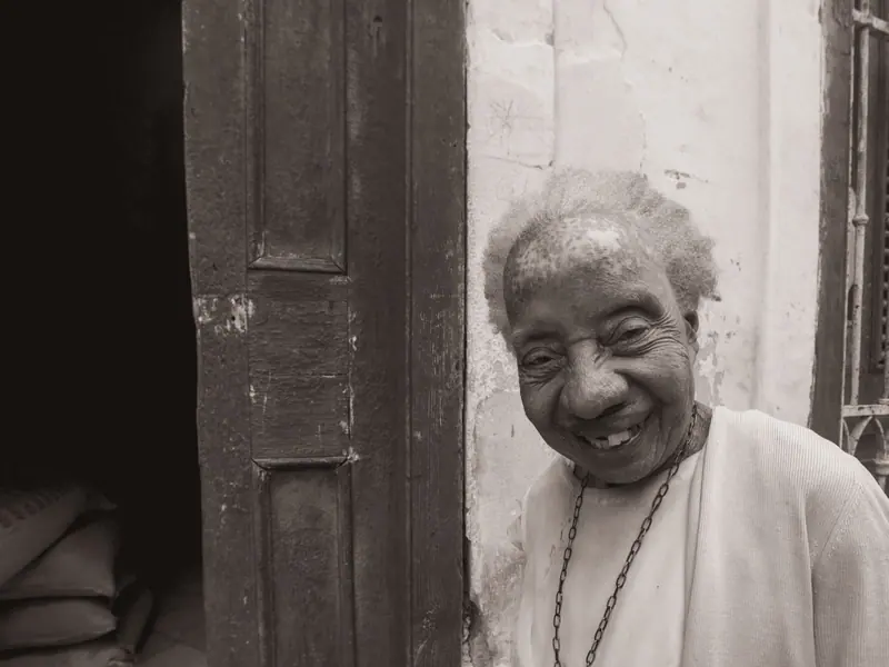 A resident smiling from a doorway