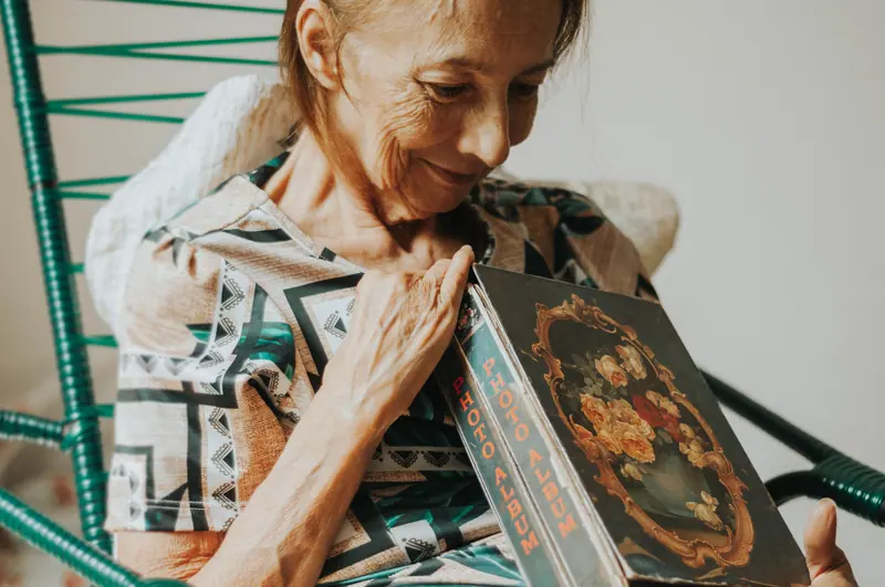 A resident smiling at a painted keepsake box