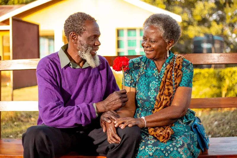 A couple laughing together on the porch