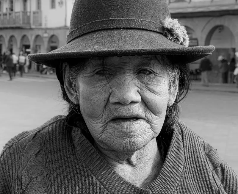 Black-and-white portrait of a resident in a felt hat