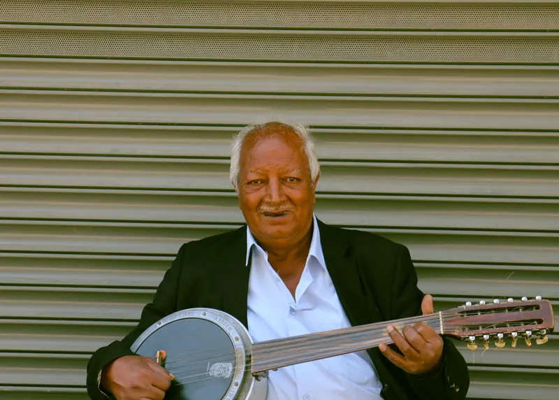 A resident playing the banjo