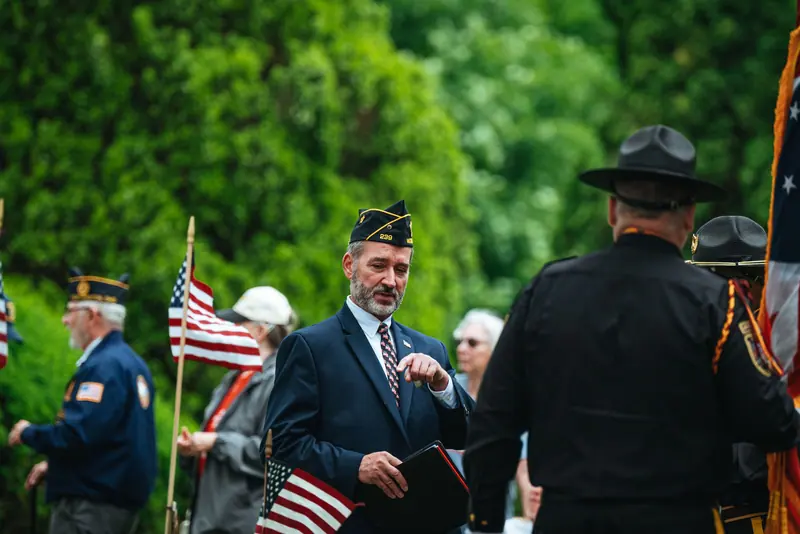 Veterans carrying flags in a Memorial Day procession