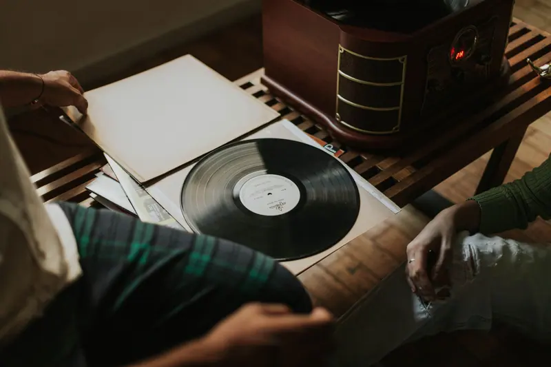 The record player and a stack of albums in the parlor