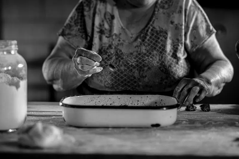 A resident working at the old enamel pan