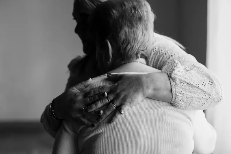 Two people in a long embrace