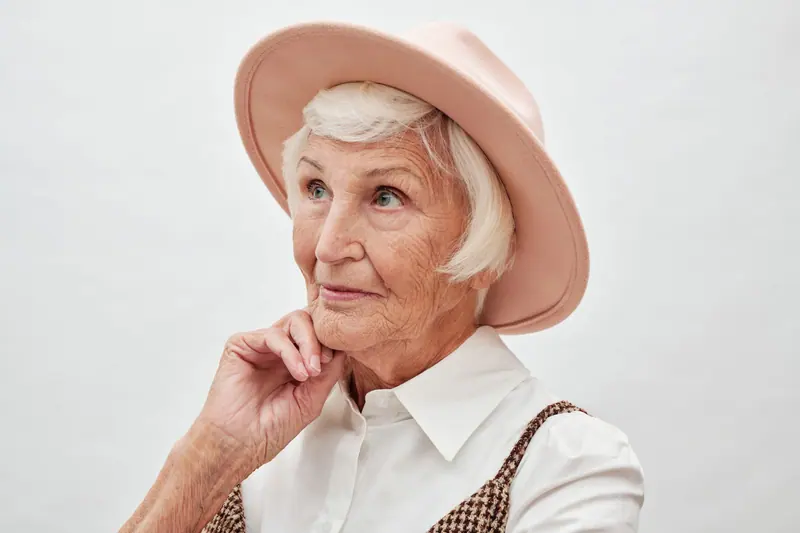 Portrait of a resident in a pink felt hat