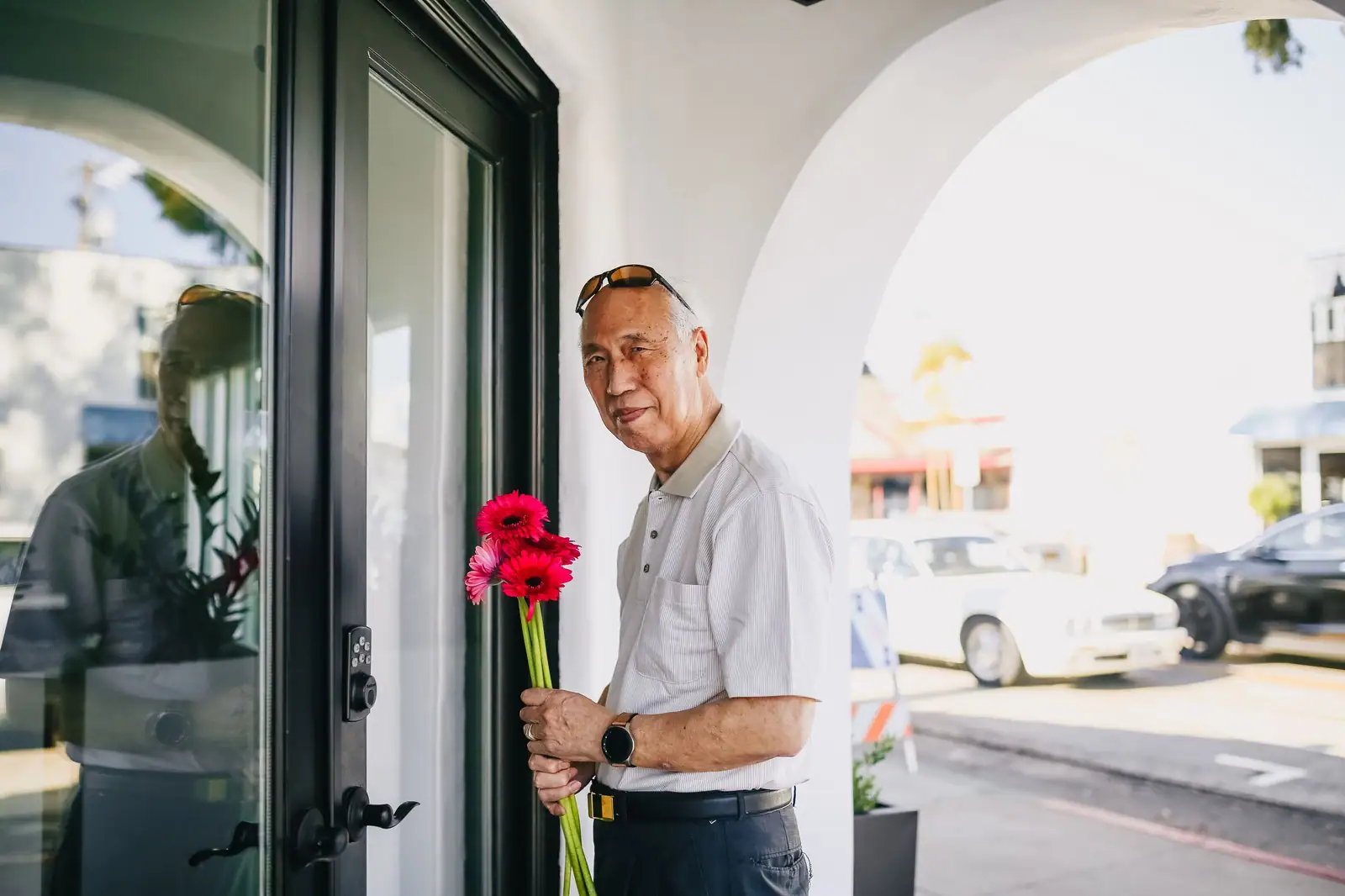 A veteran with a red carnation on Memorial Day