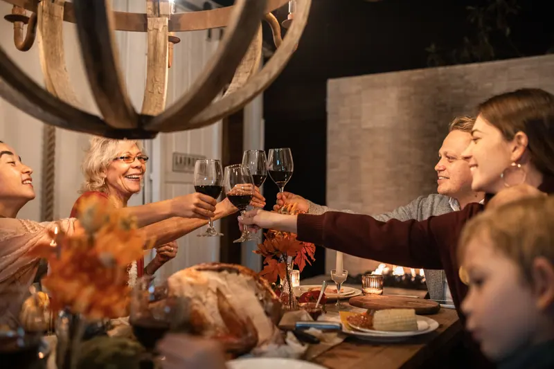 Families raising a toast at the holiday dinner