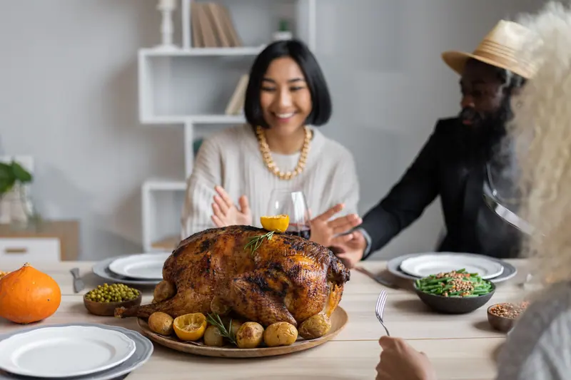 A friend laughing at the holiday table