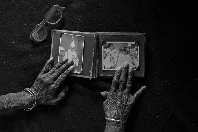 Hands resting on a family photo album