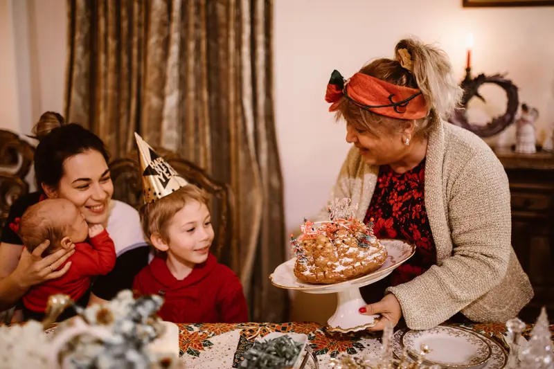 A resident serving cake at the Christmas party