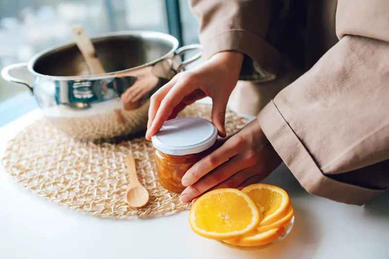 Filling jars in the canning kitchen