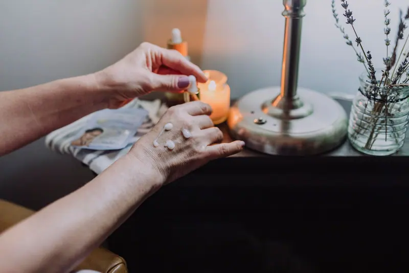 A candle being lit on the night table
