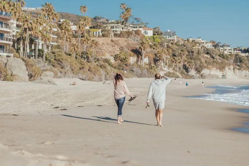Family walking the beach below the bluff