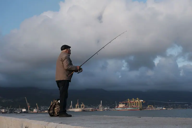 A resident fishing under a big Gulf sky