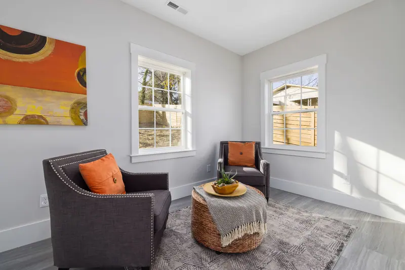 Bright and modern living room with stylish decor and natural lighting.