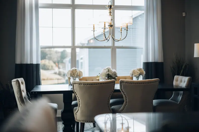 The dining room set for supper under the chandelier